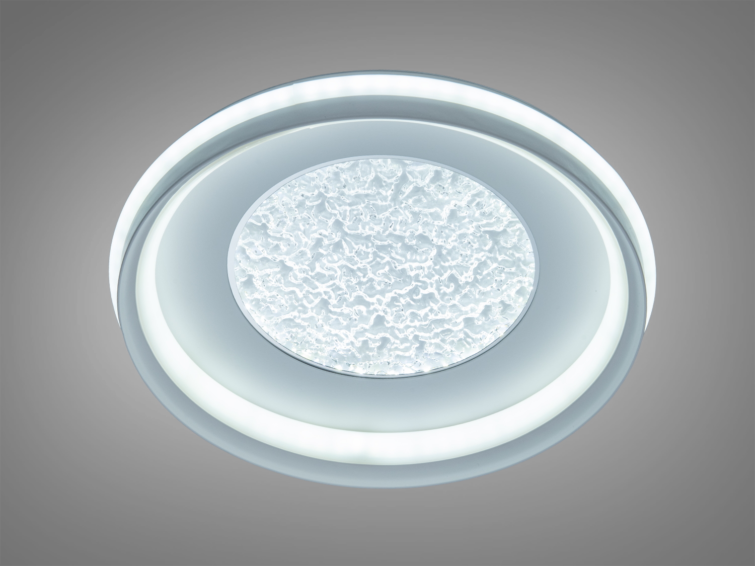 Стельова лампа з прозорим акриловим диском у центрі, що надає сучасний стиль і підходить для офісних приміщень.