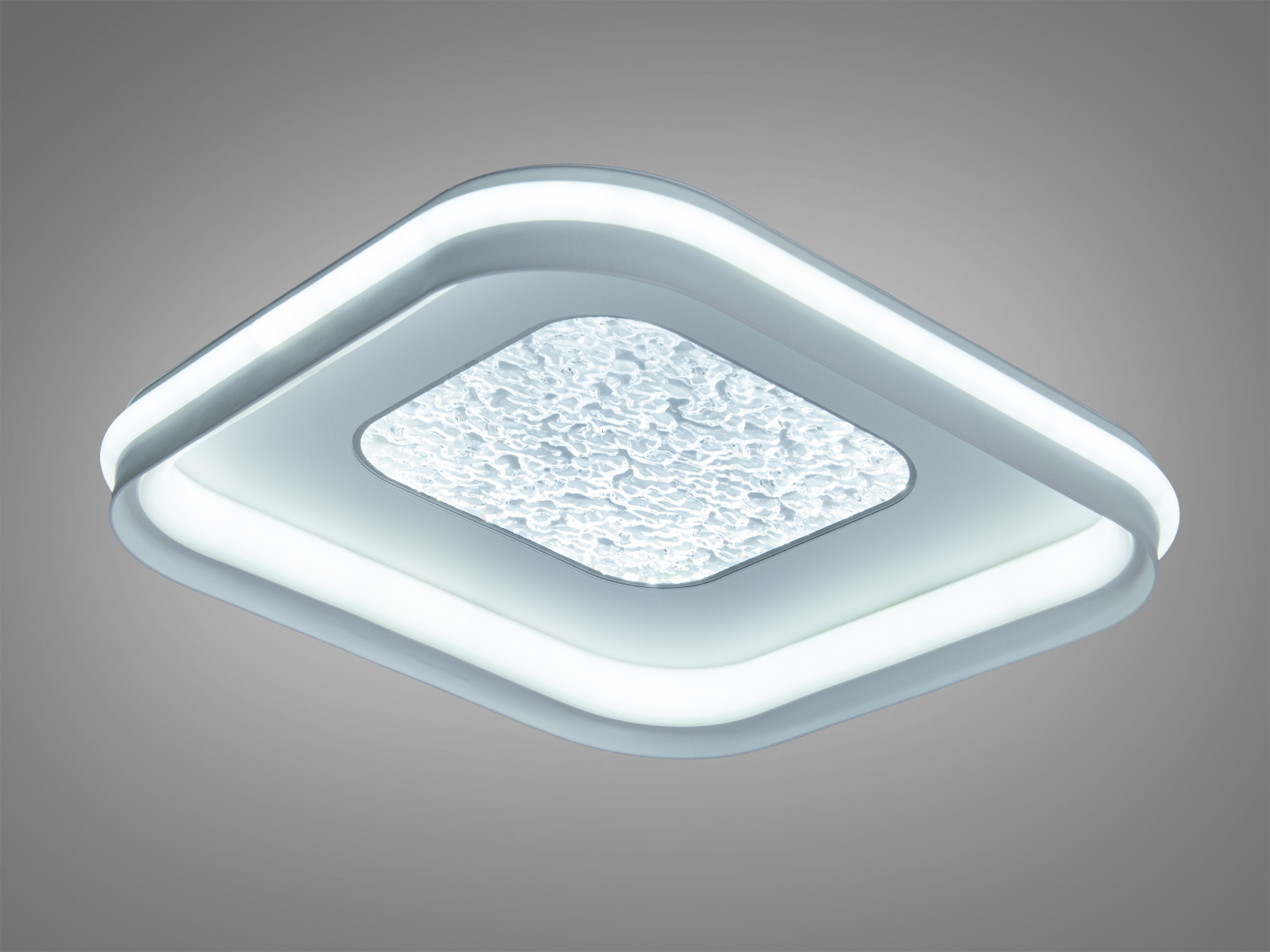 Стельовий світильник з сучасним дизайном, квадратна форма та текстурований центр. Випромінює холодне світло, підходить для робочих зон.