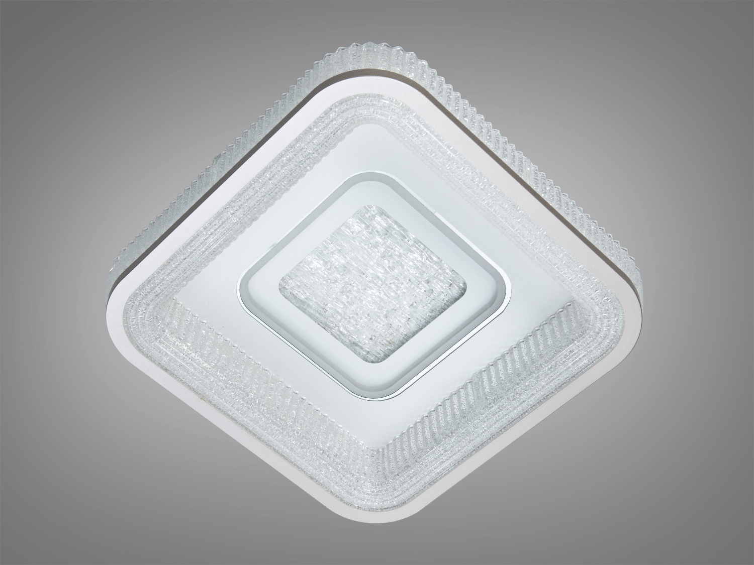 Декоративний світильник з текстурованими краями, що підкреслює сучасний стиль. Підходить для використання в офісних приміщеннях.