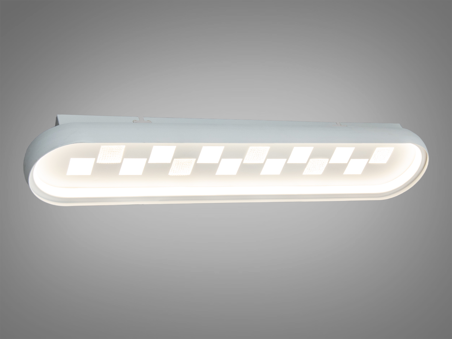 Світильник з білим корпусом, овальна форма, тепле світло, підходить для стельового монтажу в домашніх інтер′єрах.