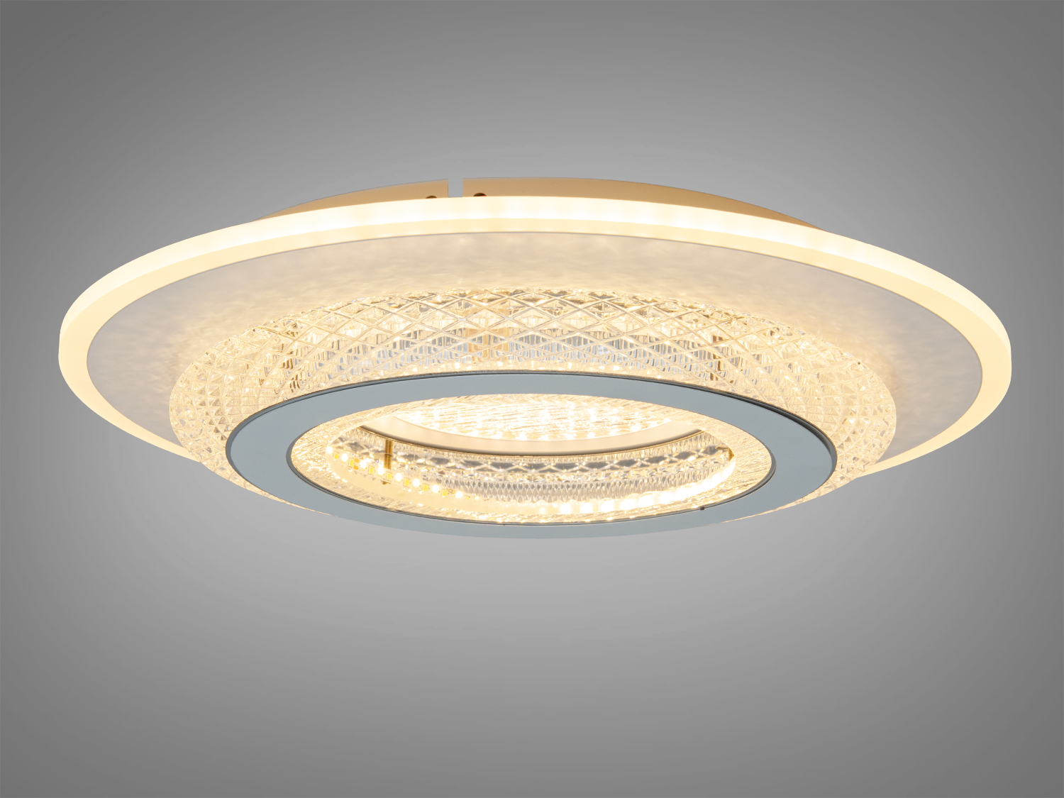 Вбудований світильник з прозорого матеріалу, що випромінює нейтральне світло, з квітковим орнаментом, підходить для стельового монтажу.