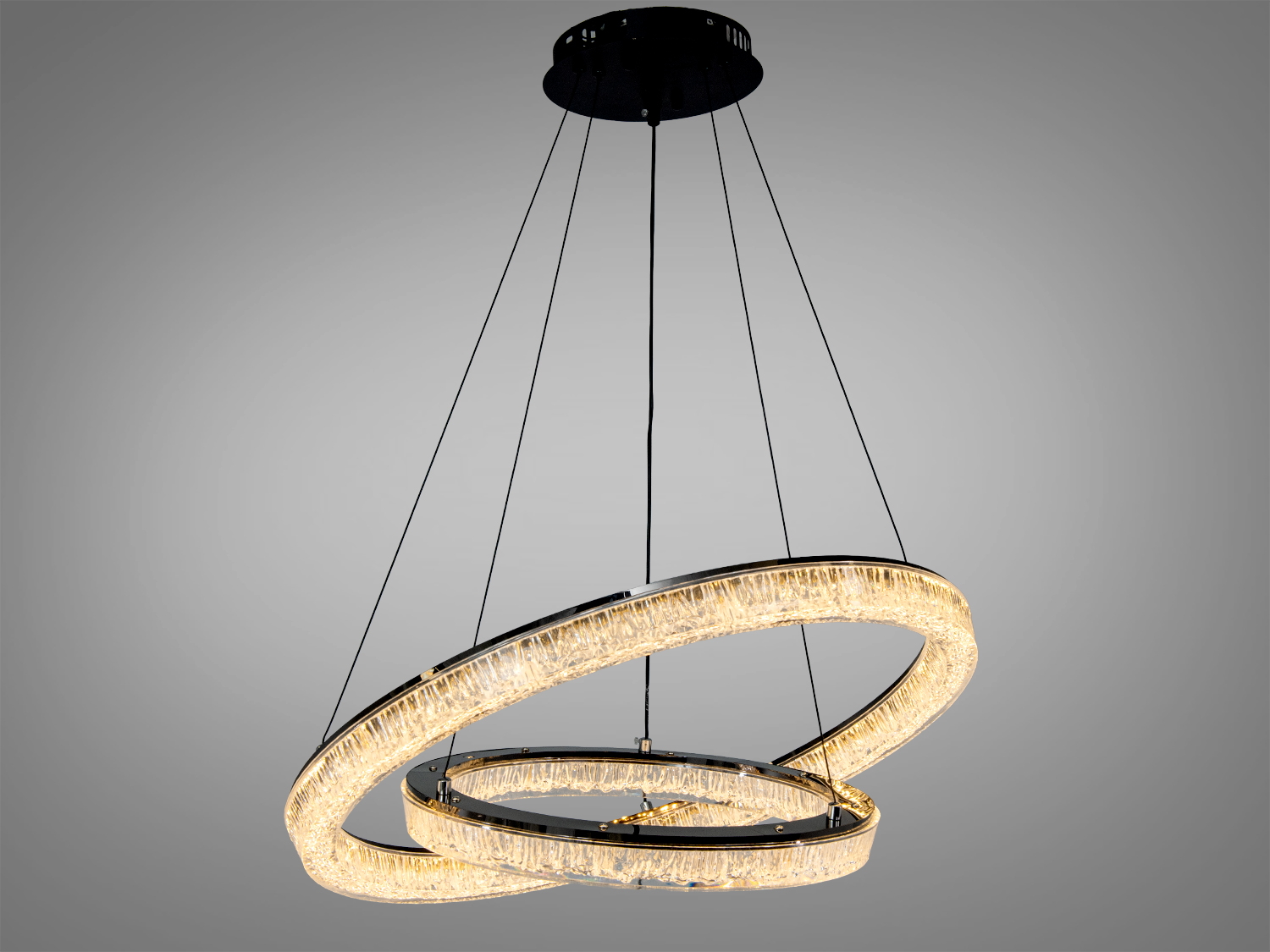 Підвісна люстра з двома кільцями, виконаними з прозорого матеріалу, підходить для сучасного інтер′єру.