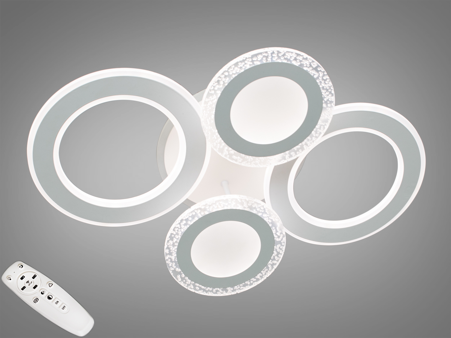 Перед Вами зовсім нове та незвичайне виконання плафонів, що обрамляють LED лампи. Така люстра легко підійде під будь-який інтер'єр &ndash; класичний, сучасний і навіть у стилі &laquo;хай-тек&raquo;.
У комплекті з люстрою йде найсучасніший тип пульта з електронним диммером та регулятором кольору. З пульта можна включити один із встановлених режимів освітлення - тепле світло, холодне світло, нейтральне; включити синю підсвічування або режим 