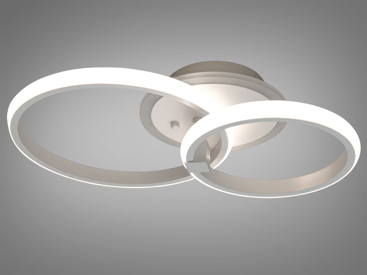 Світильник з двома кільцями, що випромінюють нейтральне біле світло, підходить для офісних приміщень або робочих зон.