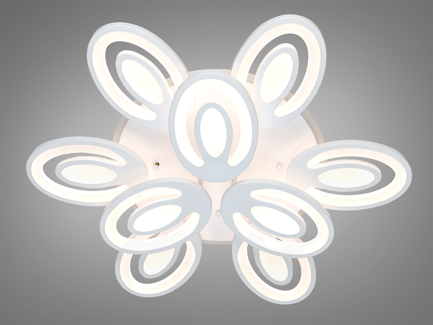 Стельова лампа з овальними кільцями, випромінює нейтральне біле світло. Підходить для офісного простору.