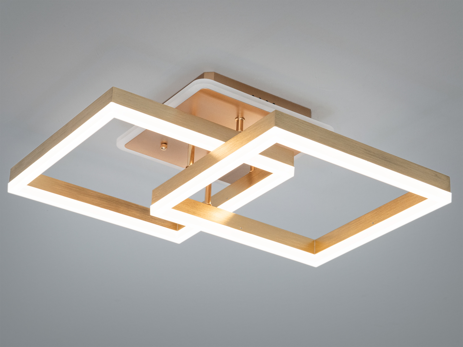 Світильник з двома квадратними рамками, що перетинаються, з пультом керування та білим підсвічуванням для сучасного інтер′єру.