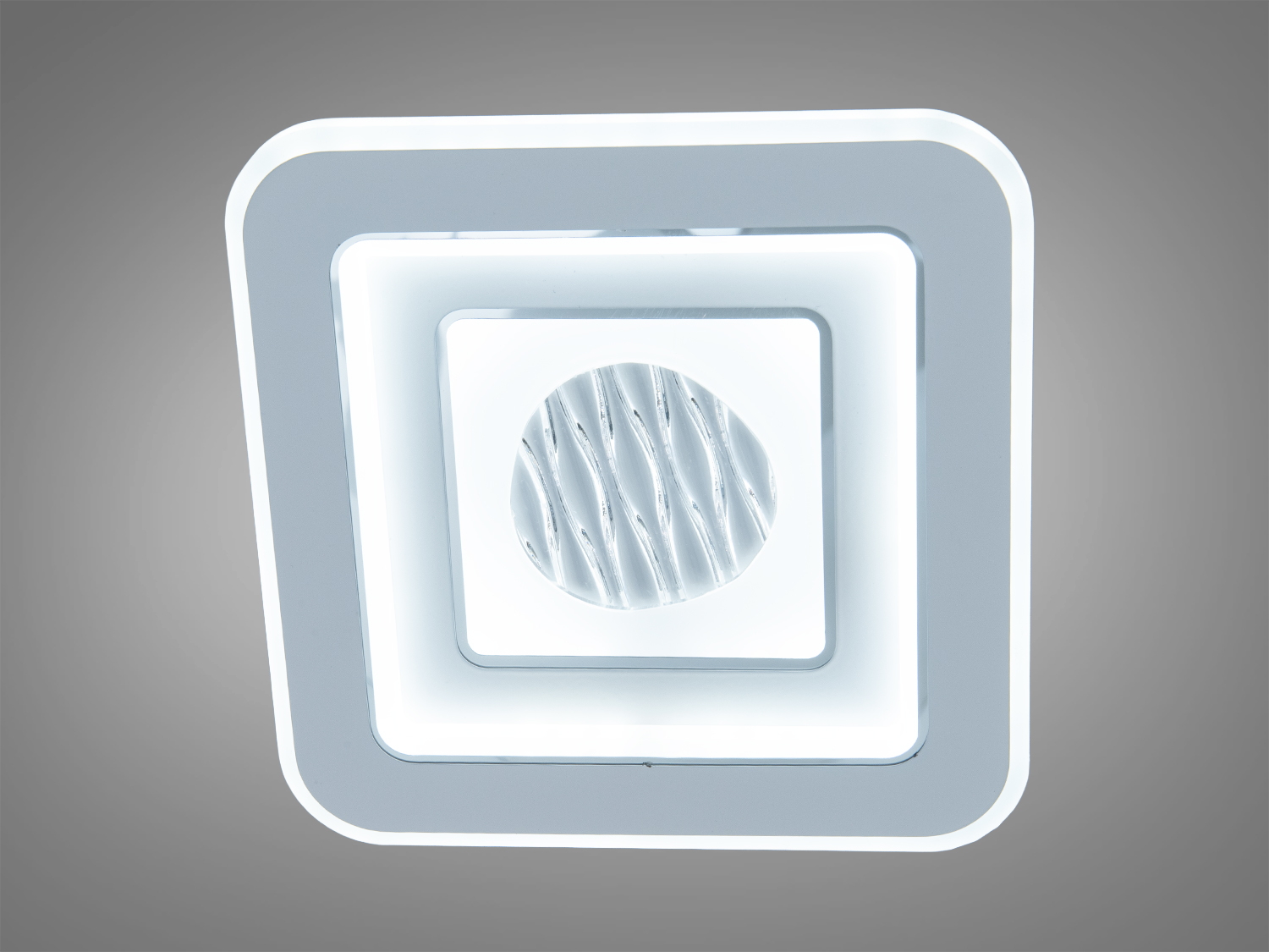 Світильник квадратної форми з холодним білим світлом, ідеальний для офісних приміщень з сучасним дизайном.