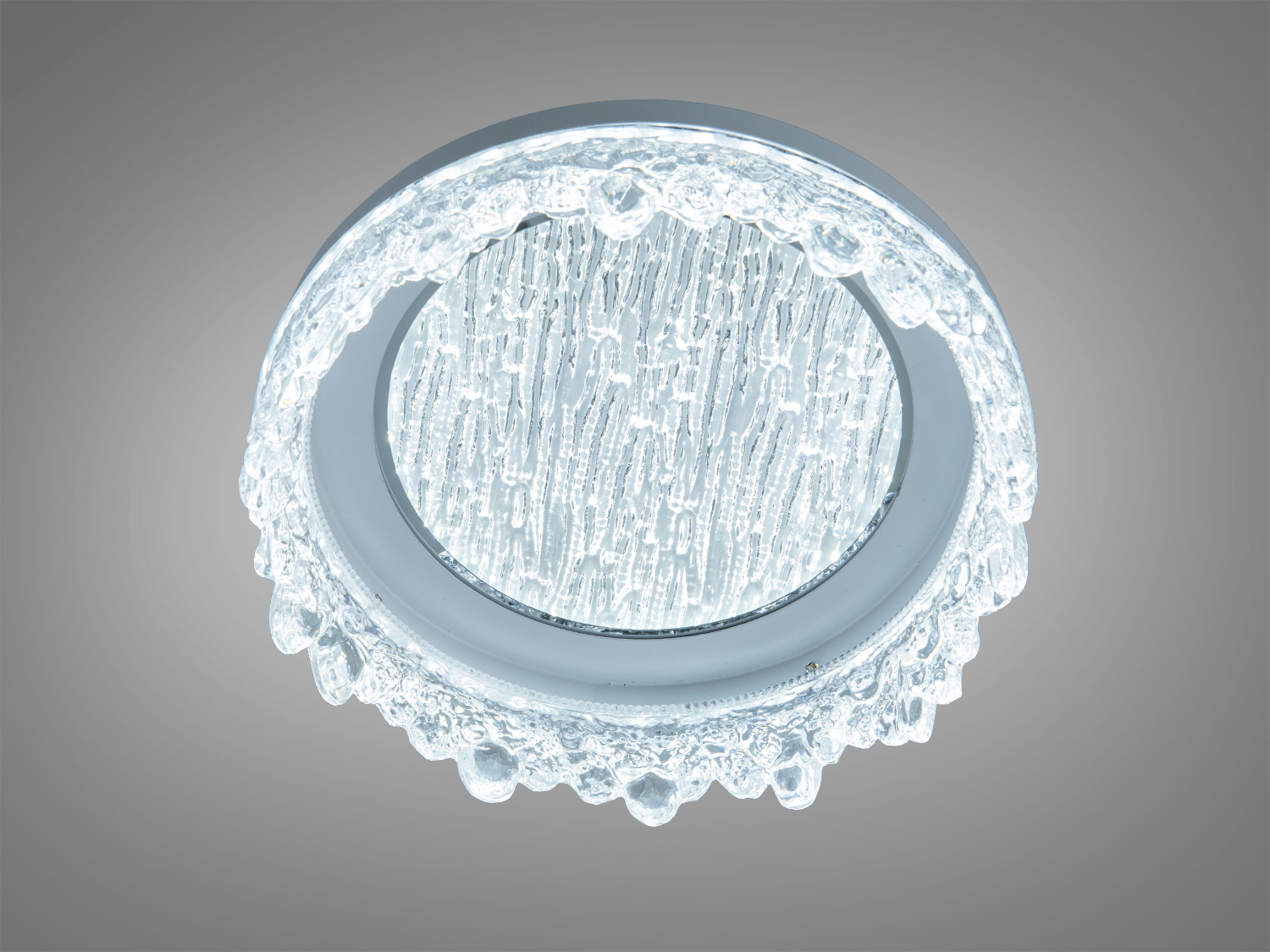 Вбудований світильник з прозорого скла, круглої форми, з ефектом льоду. Призначений для стельового монтажу в сучасних інтер′єрах.