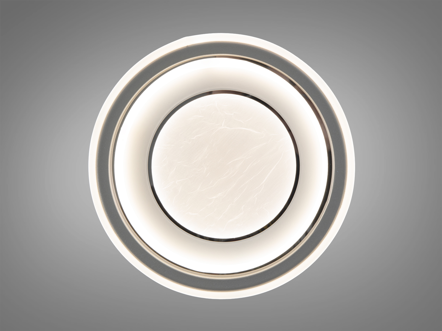 Стельова лампа з теплим світлом, круглої форми, з матовою текстурою. Ідеальна для затишних приміщень.