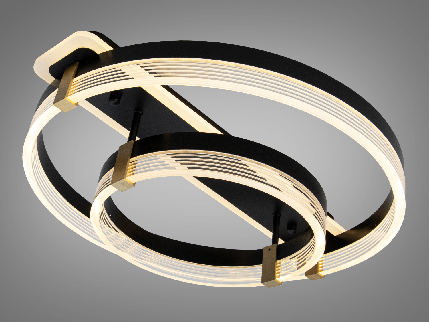 Світильник з двома кільцями, що випромінює холодне біле світло, ідеальний для освітлення великих приміщень.