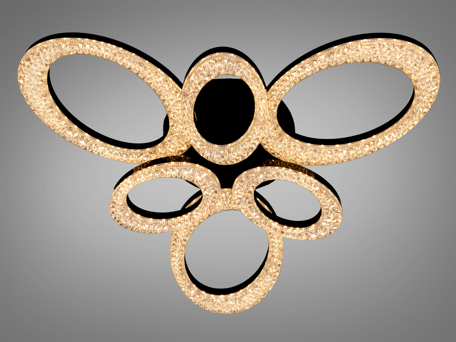 Стельова люстра з кристалічними кільцями, що випромінюють тепле світло, підходить для сучасного інтер′єру вітальні.