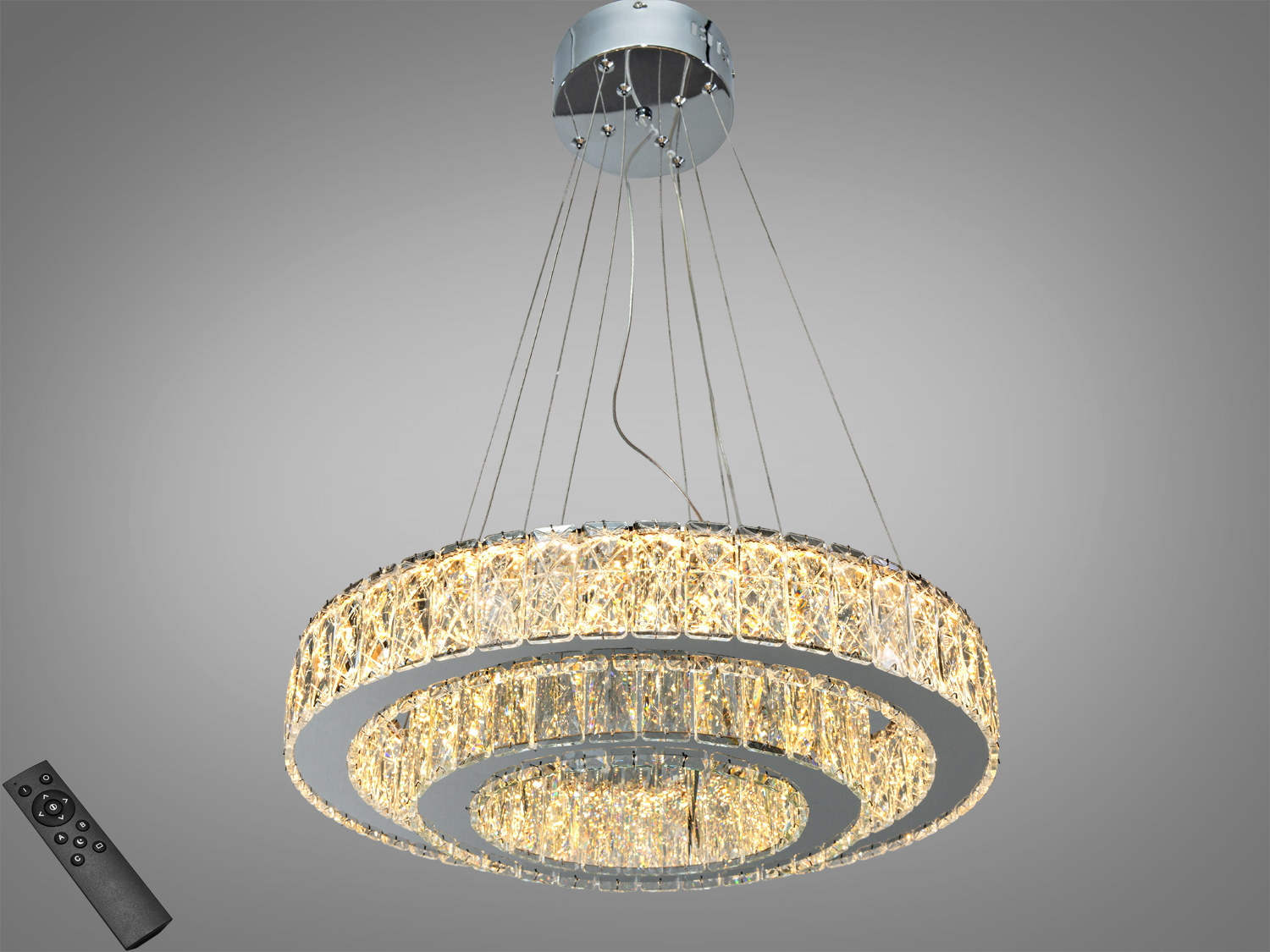 Кругла підвісна люстра з кришталевими елементами, оснащена пультом дистанційного керування. Призначена для сучасних інтер′єрів.