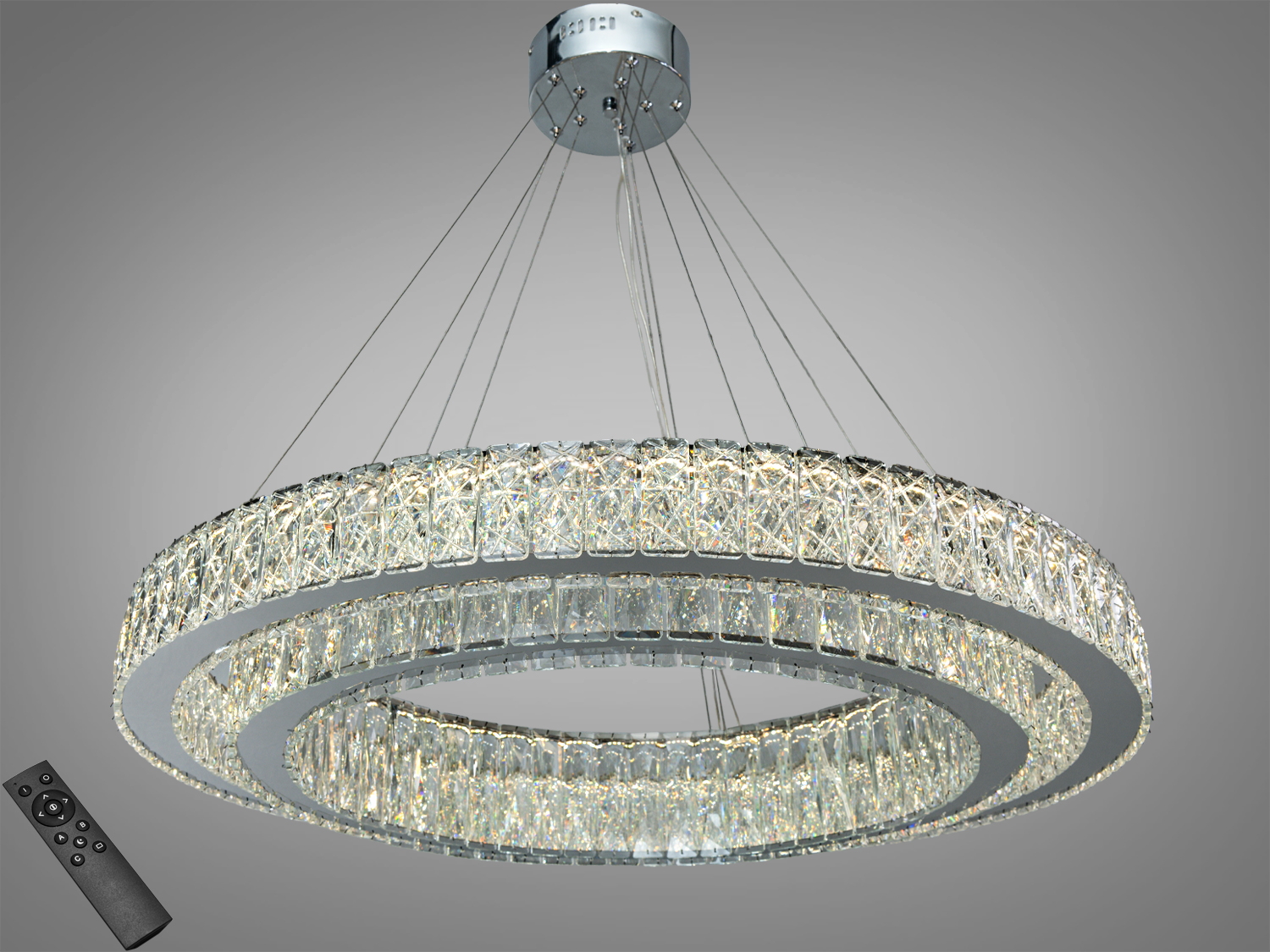 Кругла підвісна люстра з кришталевими елементами, оснащена пультом дистанційного керування. Підходить для сучасних інтер′єрів.