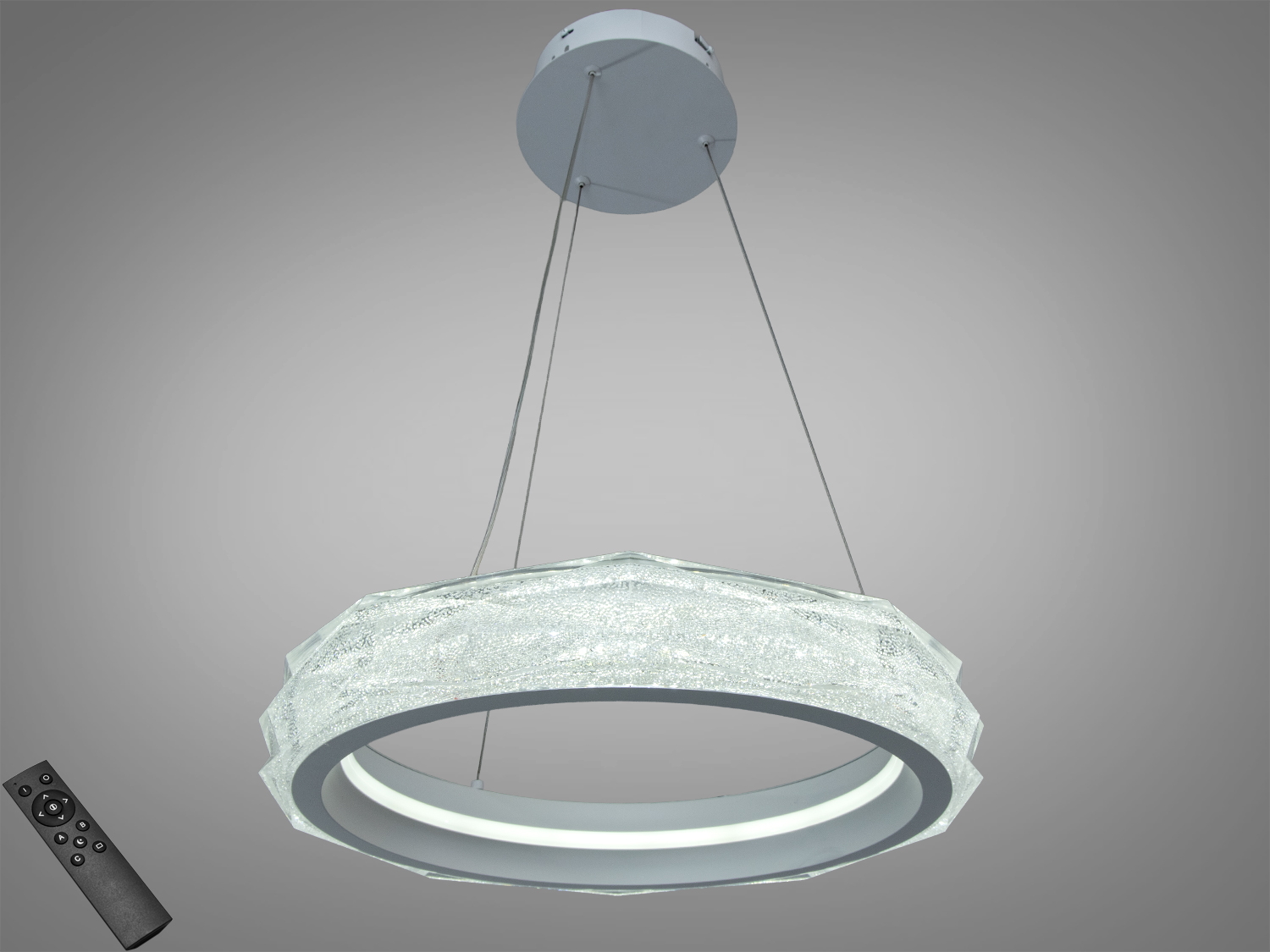 Підвісний світильник у формі кільця з дистанційним керуванням. Прозорий матеріал створює ефект кришталю, підходить для сучасних інтер′єрів.