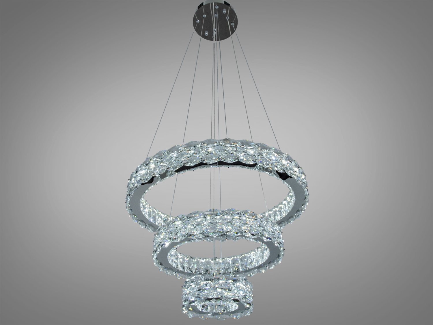 Світильник з трьома рівнями, виконаний у формі кілець, забезпечує рівномірне освітлення. Ідеальний для вітальні.