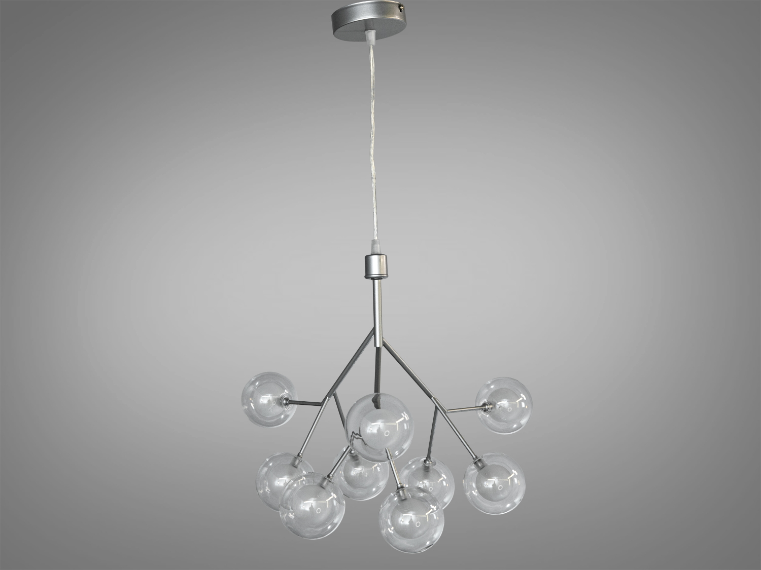 Люстра з дев′ятьма скляними кулями на металевій основі, підвішена на кабелі. Підходить для сучасного інтер′єру.