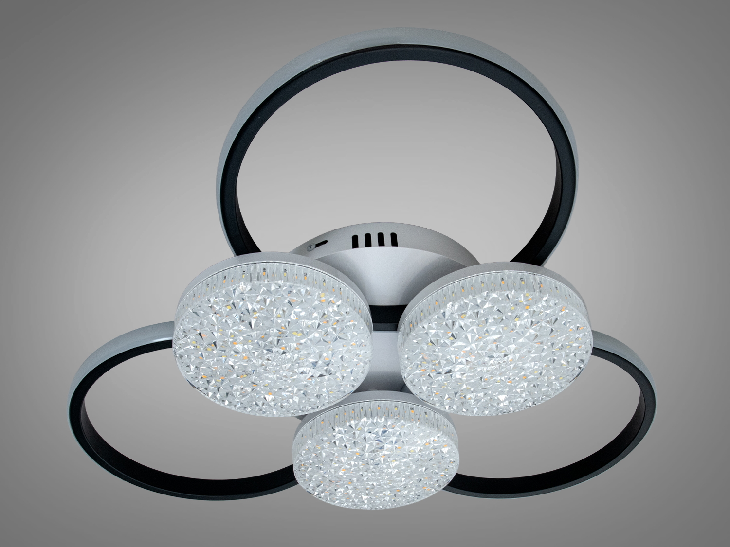 Дизайнерський світильник з трьома LED колами, що мають текстуровану поверхню. Підходить для освітлення вітальні або офісу.