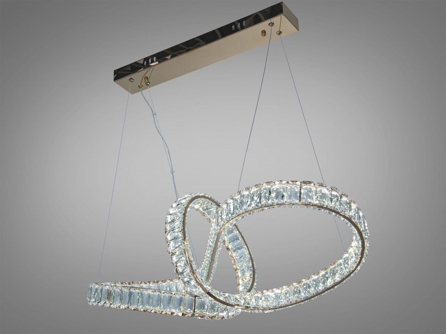 Світлодіодна люстра з двома переплетеними кільцями, підвішена на прямокутній основі. Ідеальна для освітлення великих приміщень.