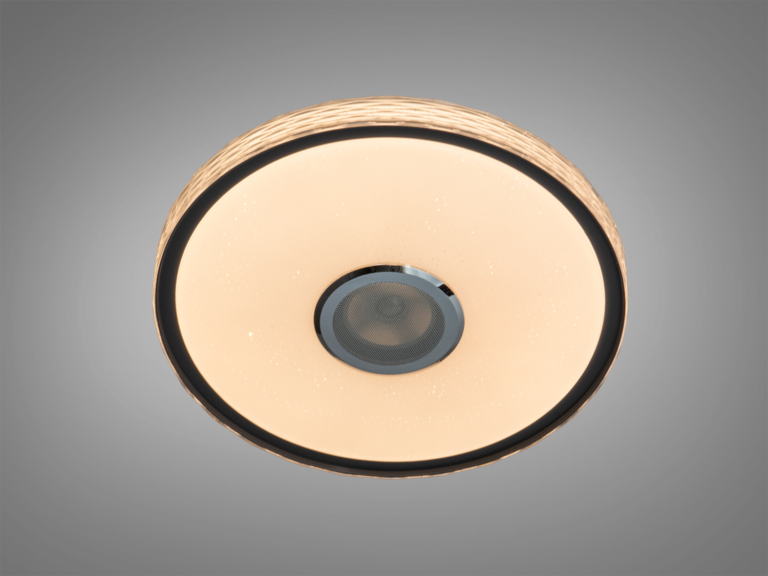 Лампа з теплим жовтим світлом для затишної атмосфери, оснащена динаміком у центрі. Підходить для вітальні.