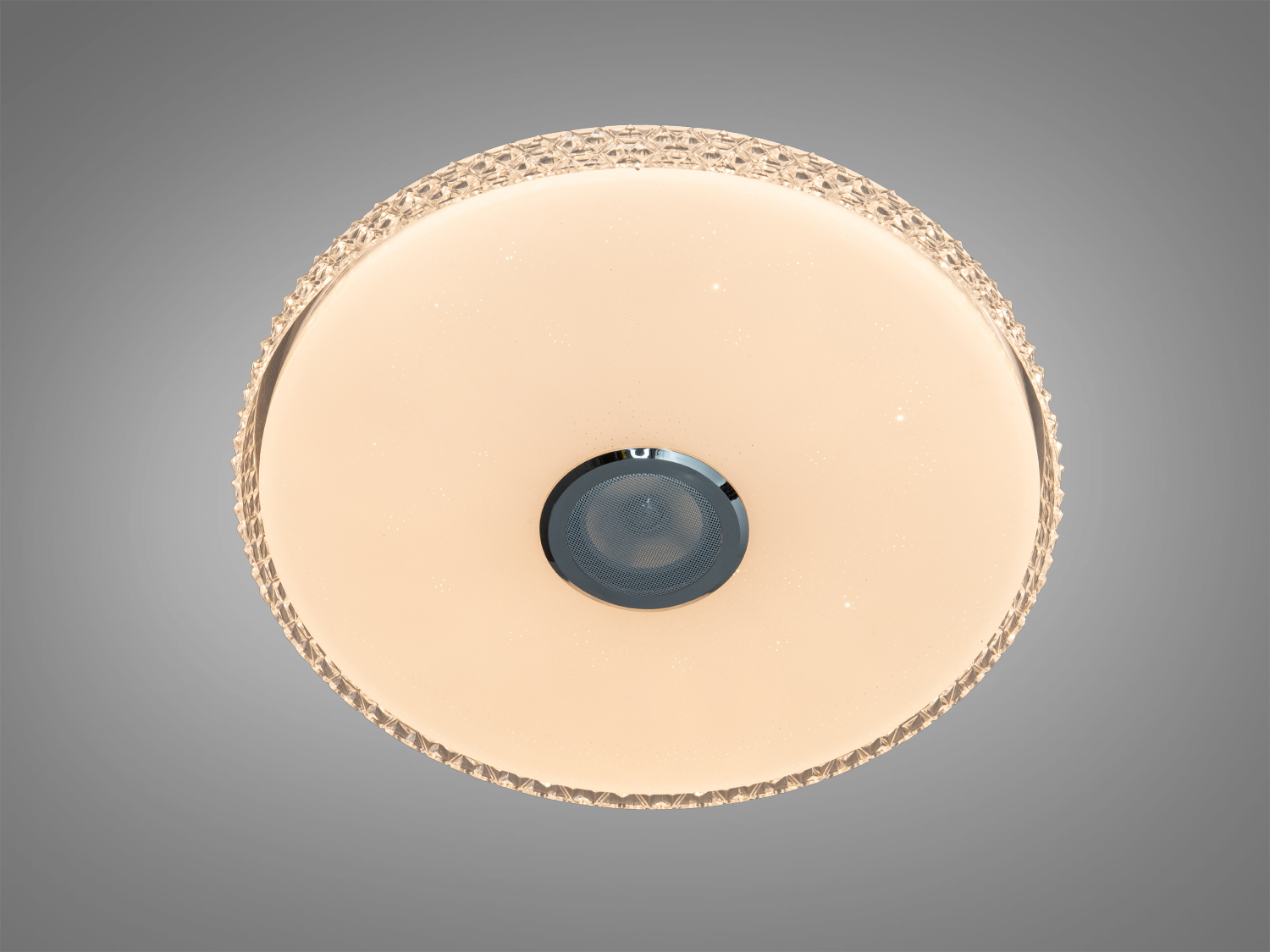 Кругла лампа з теплим світлом, має текстуровану окантовку. Ідеальна для затишних приміщень.