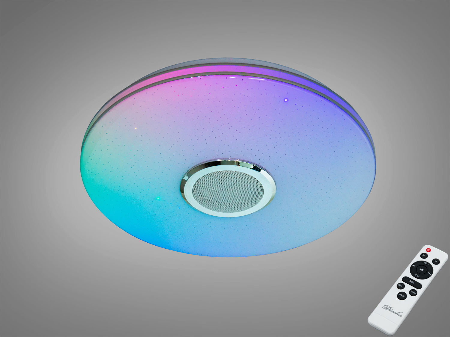 Кругла стельова лампа з кольоровою підсвіткою та вбудованим динаміком. Пульт дистанційного керування додає зручності у використанні.