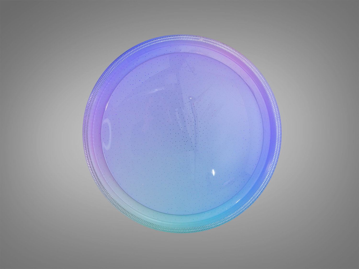 Стельова лампа круглої форми з перфорованою поверхнею, що випромінює різнокольорове світло. Ідеально підходить для декоративного освітлення.