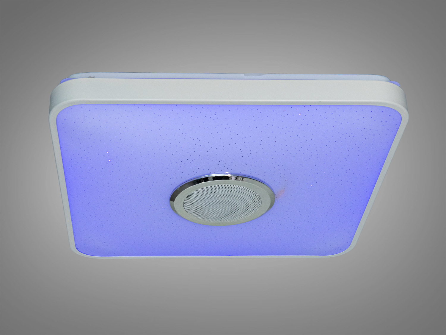 Стельова лампа квадратної форми з вбудованим динаміком. Світло фіолетового відтінку. Підходить для спальні або вітальні.