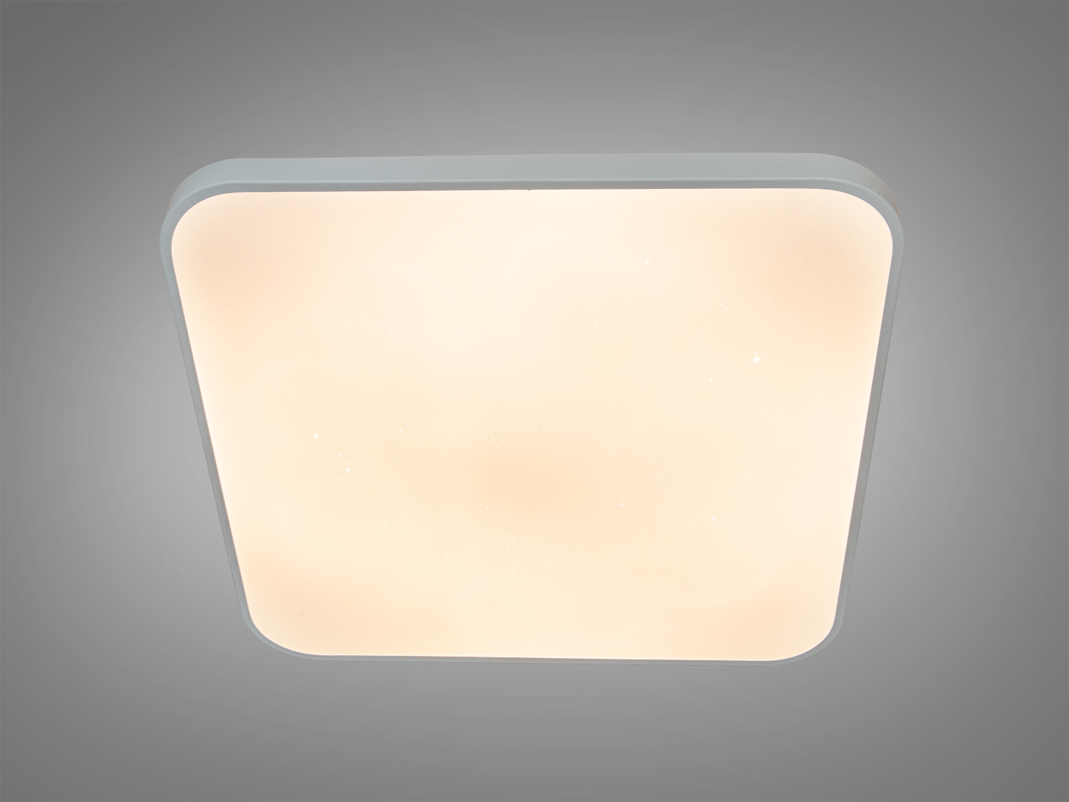 Світильник квадратної форми з теплим білим світлом, ідеальний для затишних приміщень.