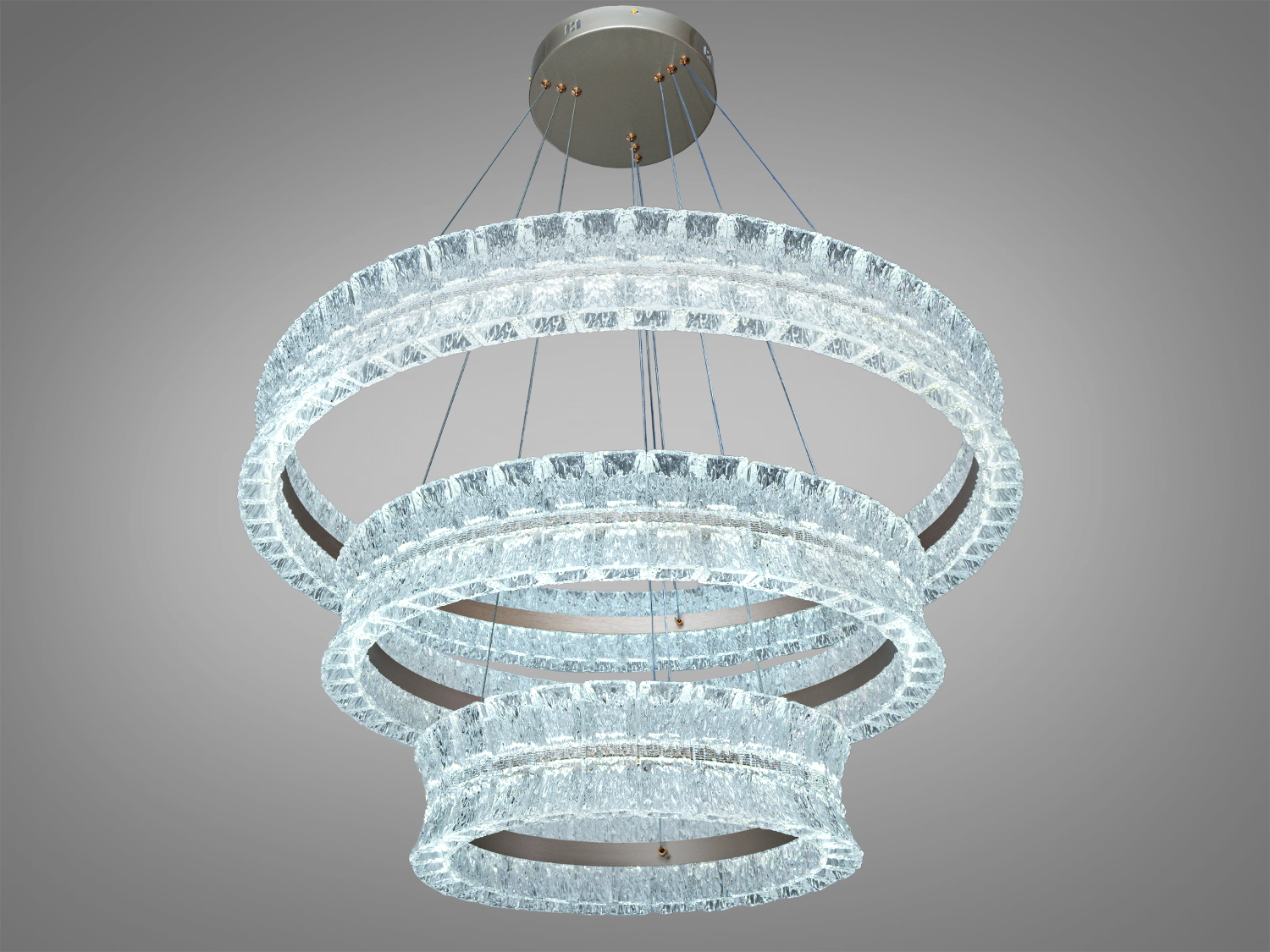 Підвісний світильник з трьома прозорими акриловими кільцями, що створюють ефектний світловий дизайн. Підходить для сучасних інтер′єрів.