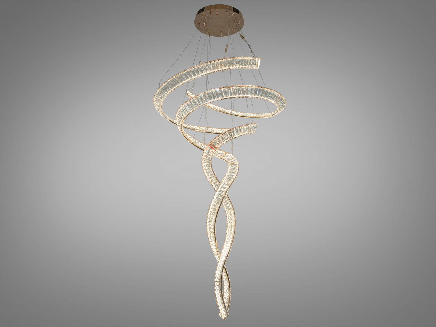 Люстра зі спіральним дизайном, виконана з прозорого матеріалу, підходить для сучасного інтер′єру.