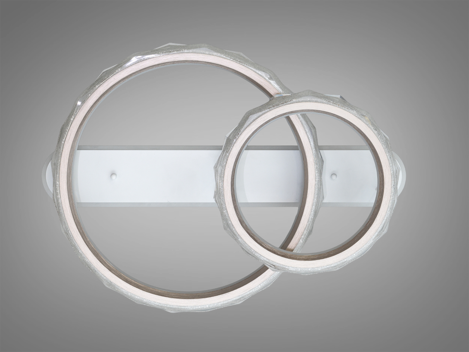 Декоративний світильник із двома акриловими кільцями, вимкнений. Використовується для сучасного дизайну інтер′єру.
