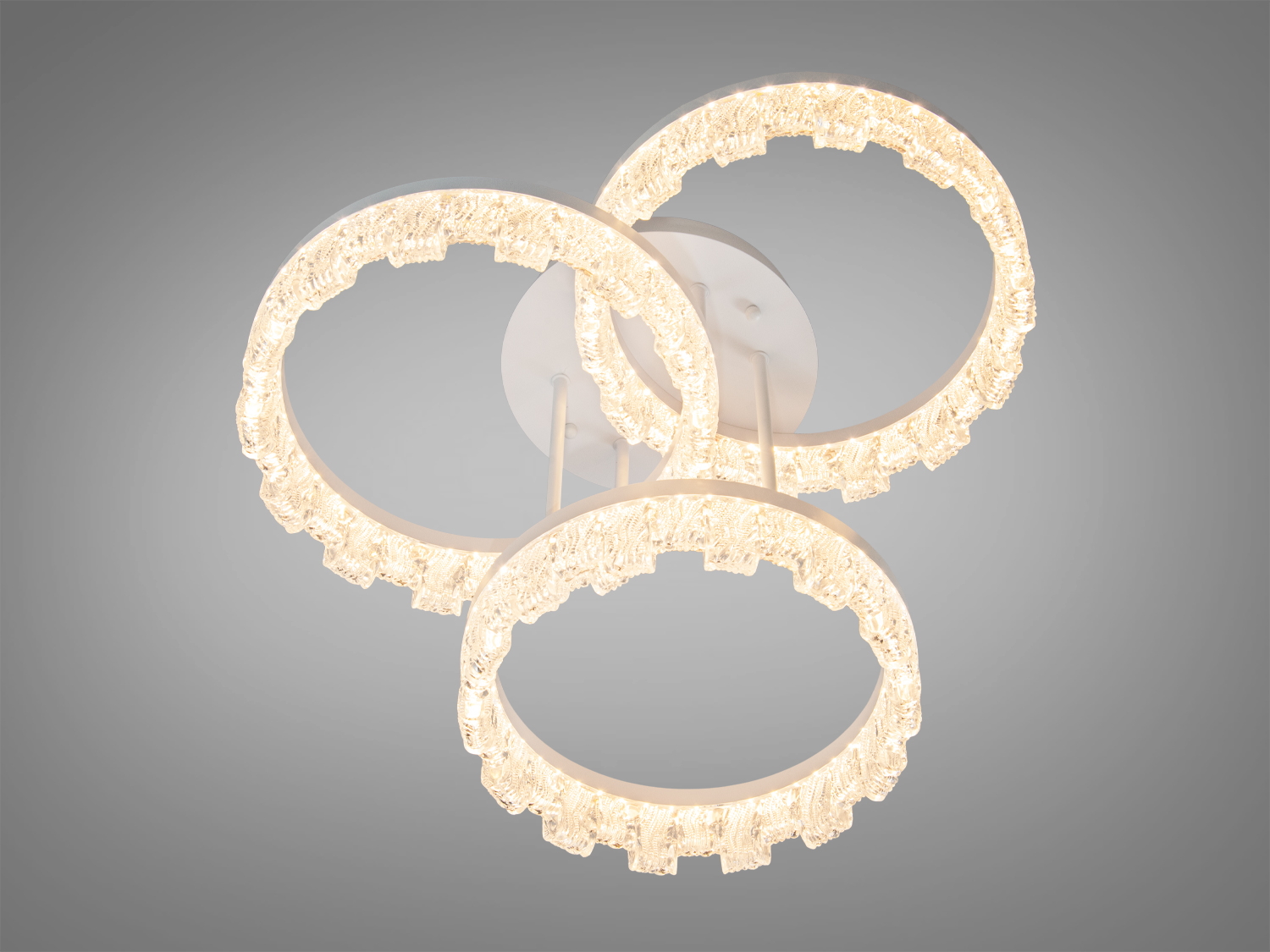 Стельова лед люстра, дизайн якої вирізняється кільцями з прозорого акрилу, що прикрашені декоративними бульбашками. 