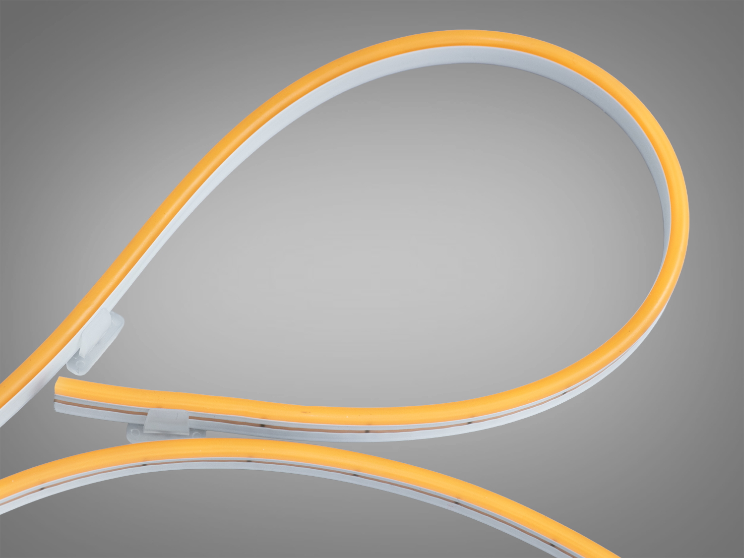 Світлодіодна стрічка з жовтим світлом, подвійна петля, підходить для підсвічування меблів або архітектурних елементів.