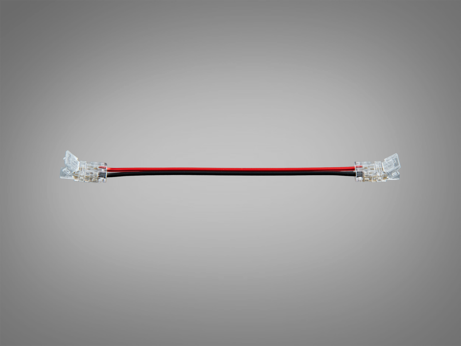 Конектор з двома прозорими роз′ємами, що підходить для монтажу в освітлювальних системах.