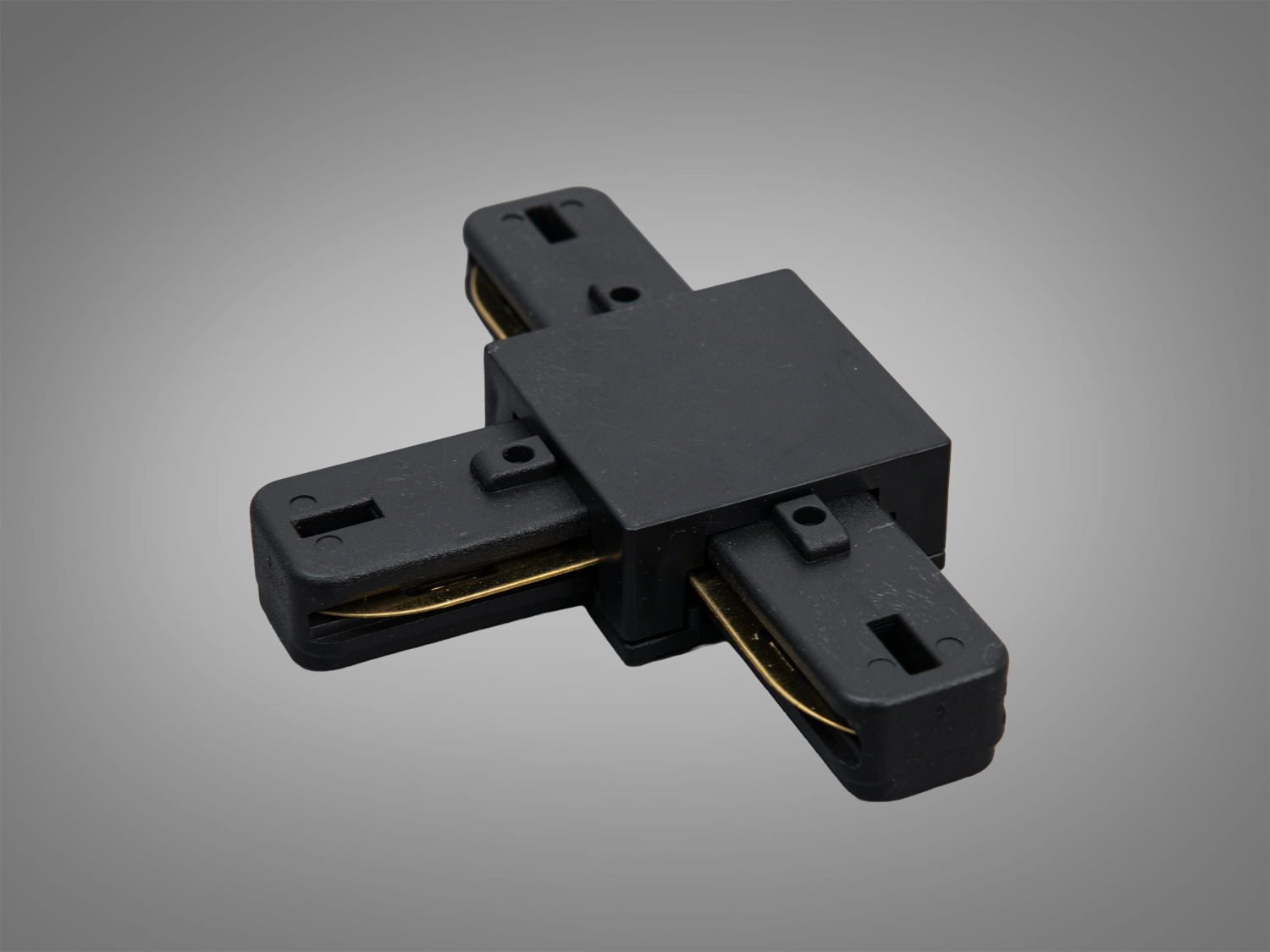 Т-подібний конектор чорного кольору для трекових світильників, з гладкою поверхнею та кріпленням для легкої інтеграції в інтер′єр.