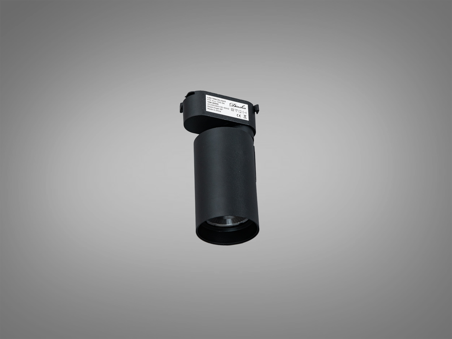 Компактний чорний світильник з циліндричним корпусом для трекової системи. Ідеальний для галерейного освітлення.