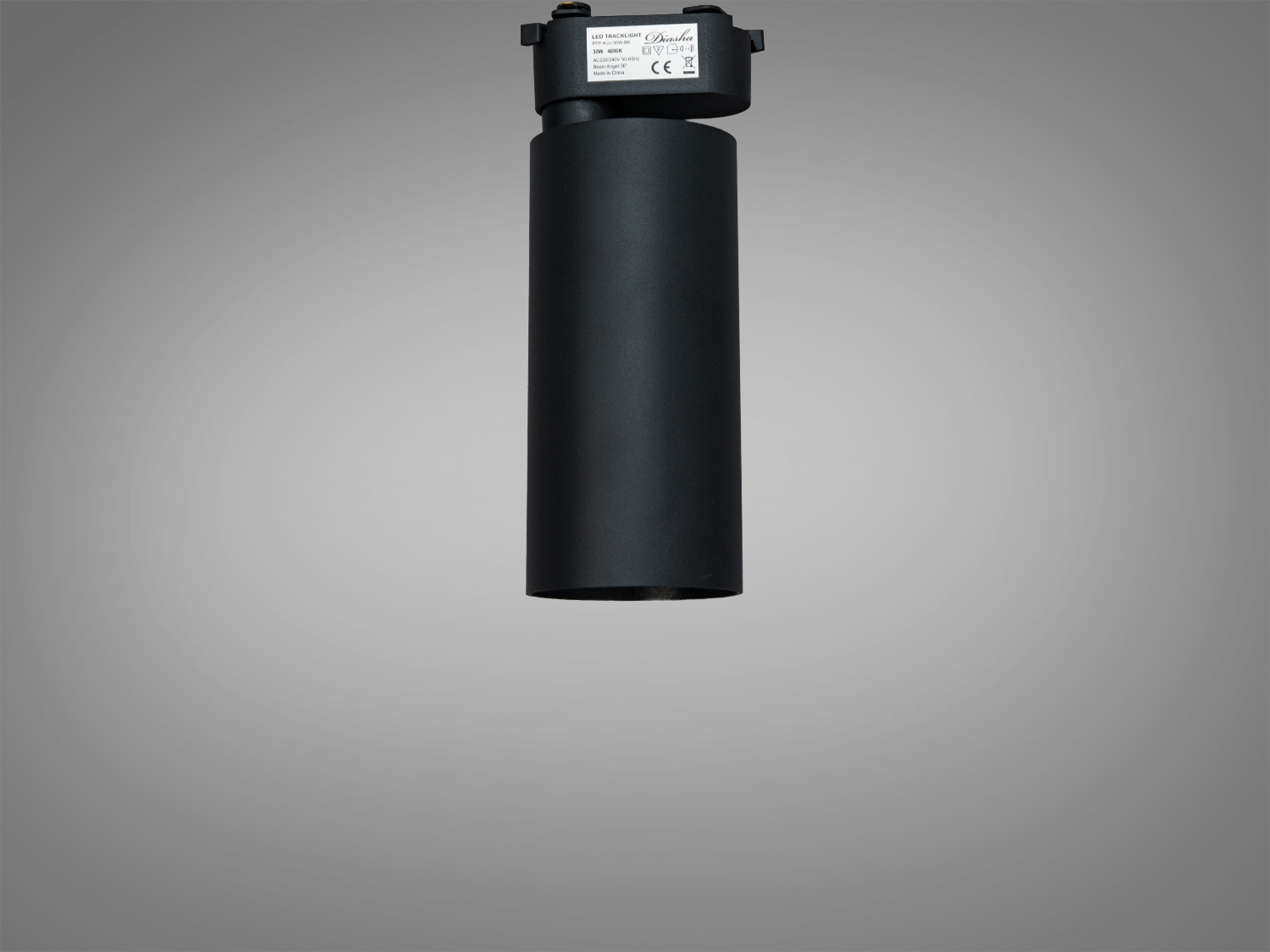 Вертикальний вигляд чорного трекового світильника, показує його циліндричну форму та технічні характеристики на етикетці.