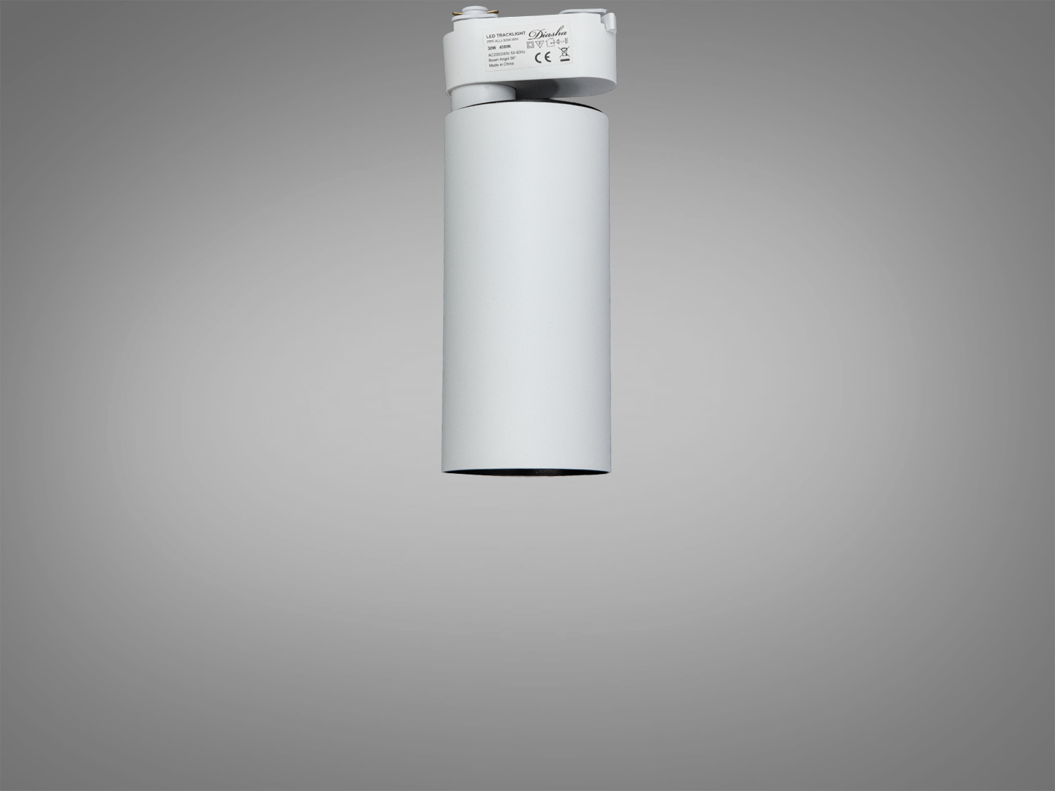 Вертикально підвішений білий циліндричний світильник для трекових систем. Підходить для освітлення комерційних приміщень.