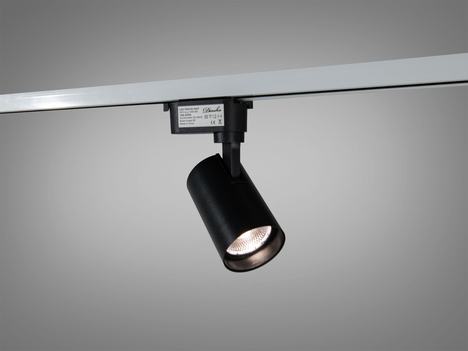 Поворотний чорний трековий LED світильник 10 Вт для систем 220 В з магнітним кріпленням. Нейтральне світло 4000К для керованого акцентного освітлення у магазині, галереї або вдома.