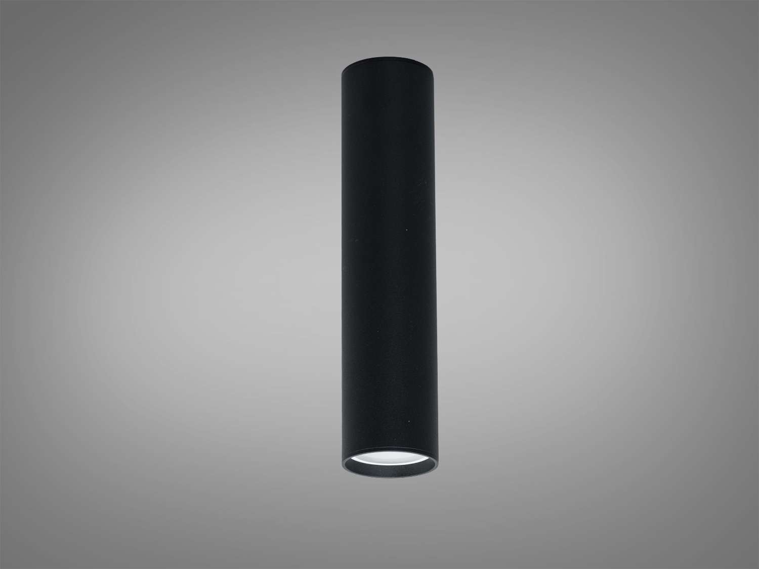 Чорний циліндричний світильник для стельового монтажу, виготовлений з металу, підходить для точкового освітлення в мінімалістичних просторах.
