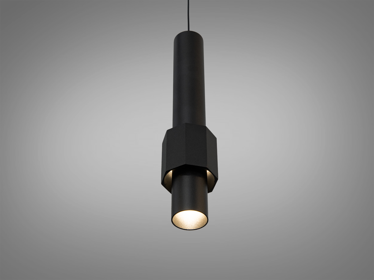 Підвісний світильник з чорного металу, циліндричний корпус, спрямоване світло, підходить для зонального освітлення.