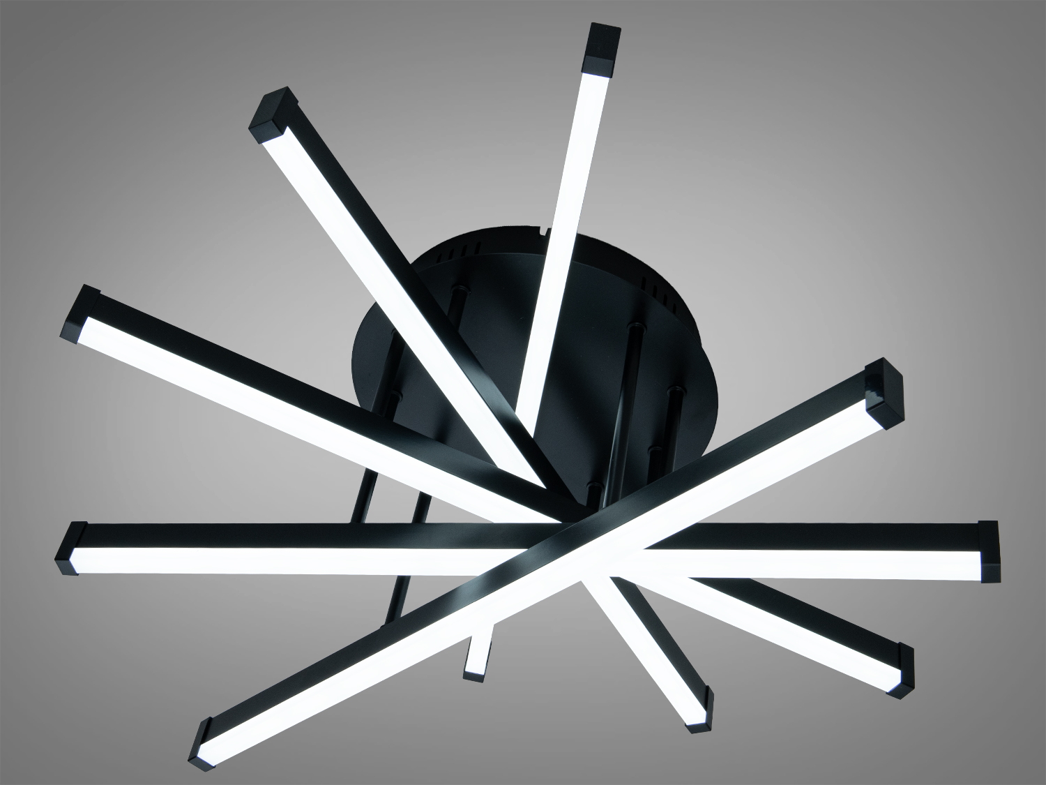 Стельовий світильник з холодним білим світлом, має зіркоподібну форму з чорними металевими планками, ідеальний для офісного простору.