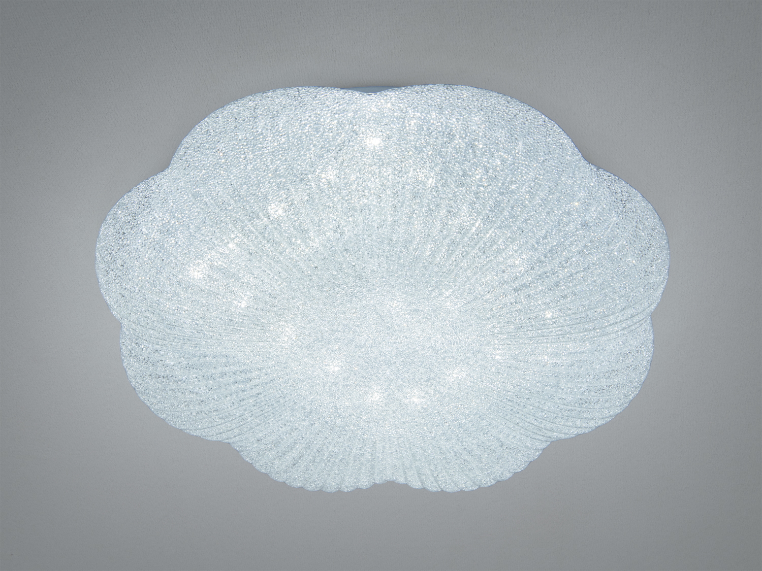 Стельовий світильник з рельєфного скла у формі квітки, що випромінює холодне світло. Підходить для сучасних житлових приміщень.