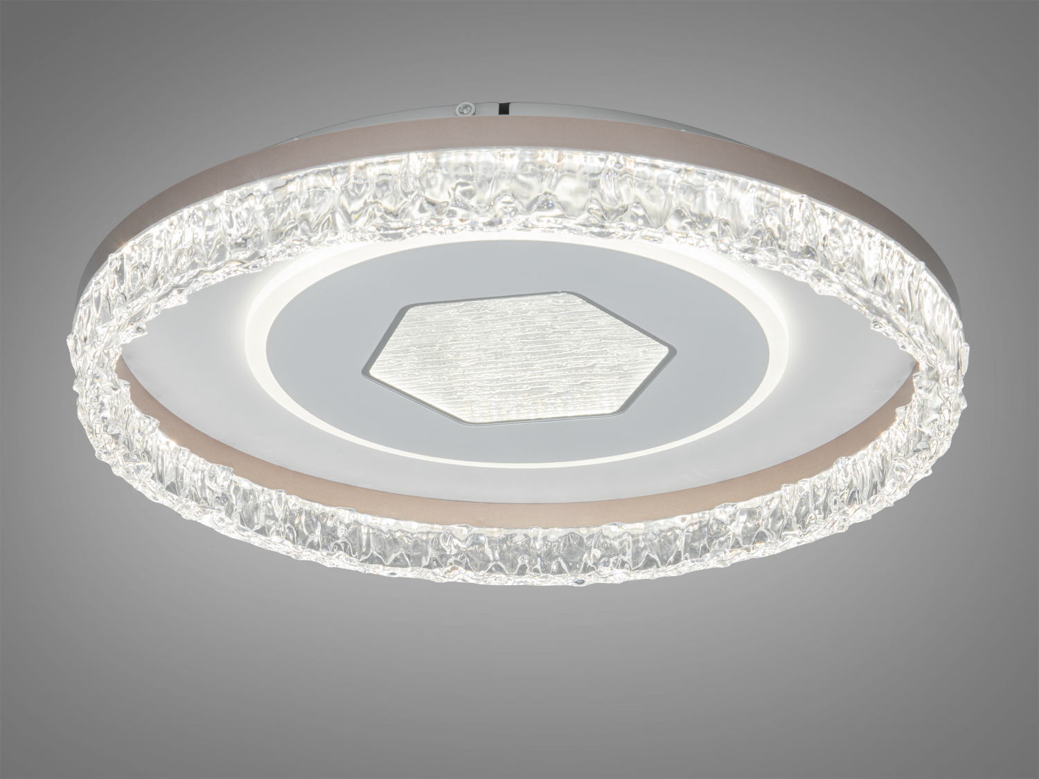 Лампа з об′ємним прозорим обідком і центральним шестикутником. Підходить для монтажу на стелі в будь-якій кімнаті.