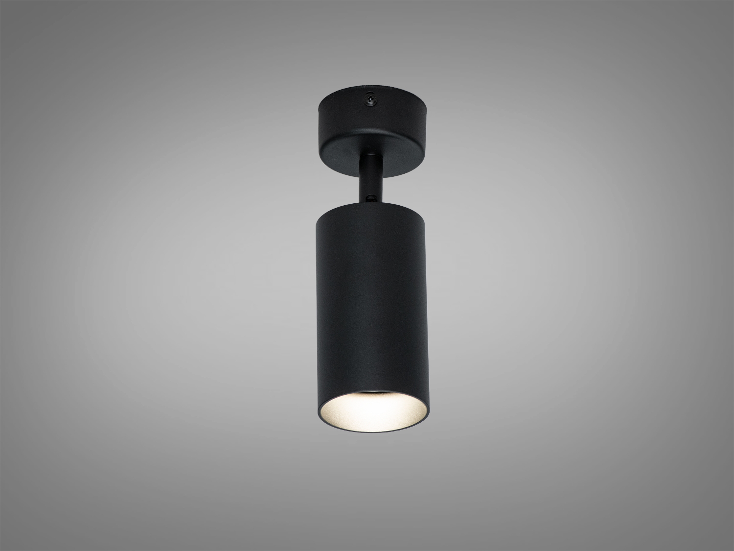 Чорний циліндричний світильник для стелі, підходить для сучасного інтер′єру. Встановлюється на кріплення, забезпечує спрямоване освітлення.